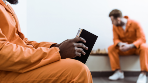 Prisoner reading a book