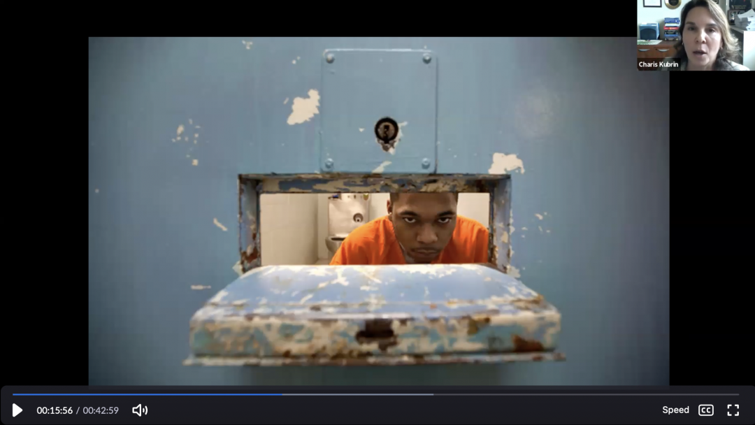 Professor Charis Kubrin interviewing an inmate.