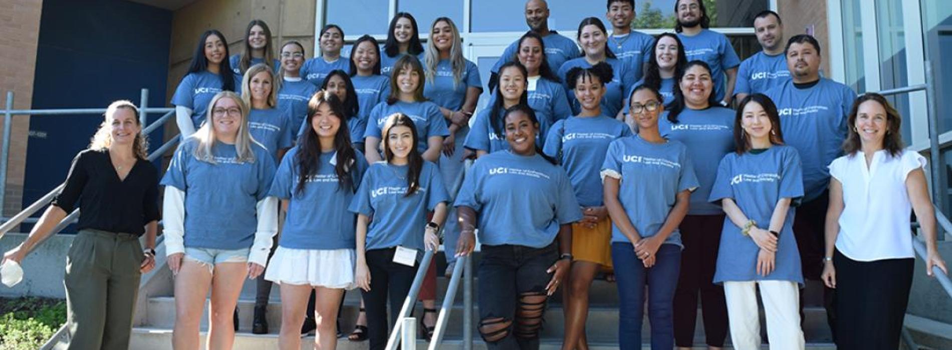 Amanda Geller (bottom left) and Charis Kubrin (bottom right), co-directors of the university’s top-ranked online M.A.S. program in the subject, flank some of the 95 students in the current cohort. Photo by Jessica Y. Gutierrez